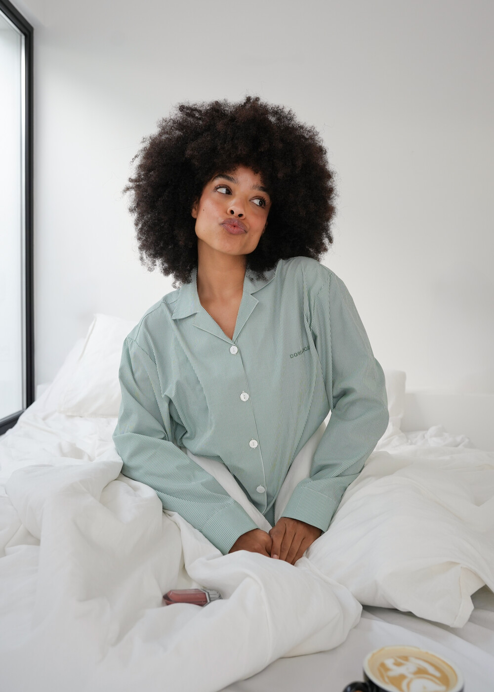 Dore and Rose sleepwear UGC, sitting on bed